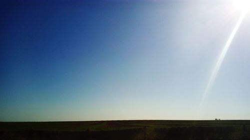 Scenic view of landscape against clear blue sky