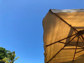 Low angle view of building against clear blue sky