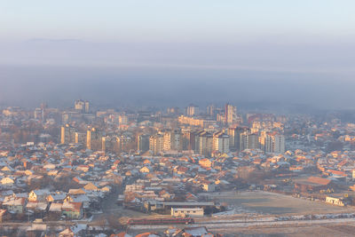 High angle view of city buildings against sky