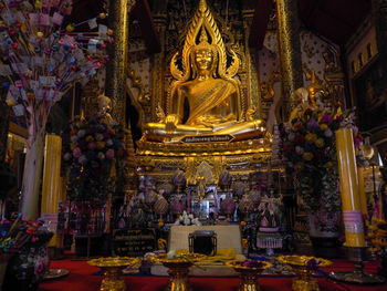 Statue in temple outside building