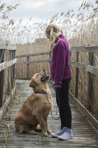 Girl with dog outdoors