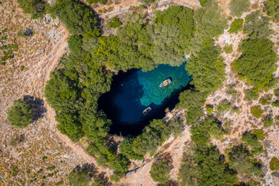 High angle view of rocks in sea