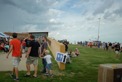 People standing against sky