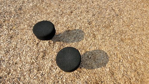 High angle view of pebbles on sand