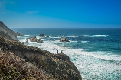 Scenic view of sea against blue sky