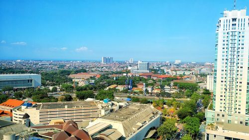 High angle view of townscape against blue sky