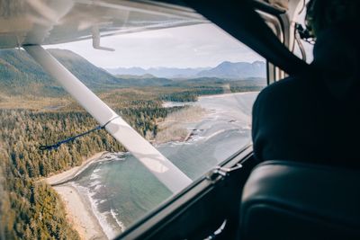 Scenic view of sea seen through airplane window