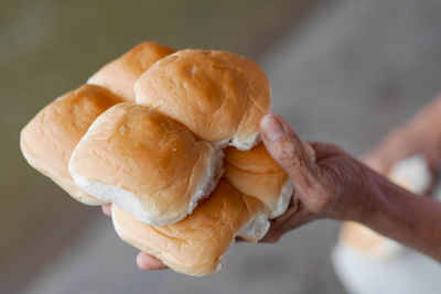 Close-up of hand holding ice cream