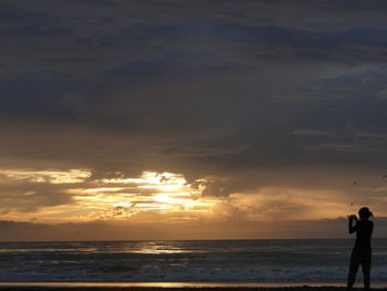 Scenic view of sea at sunset