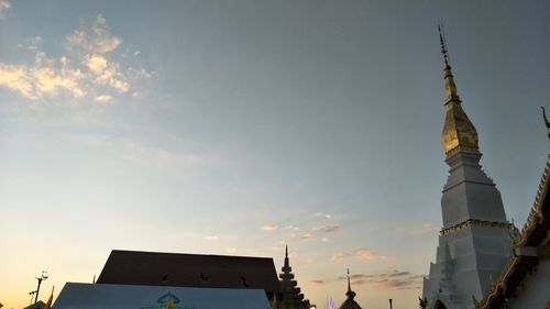 Low angle view of buildings against sky during sunset