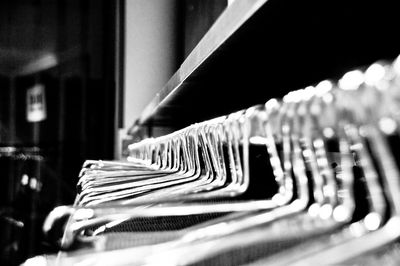 Close-up of clothes hanging in row