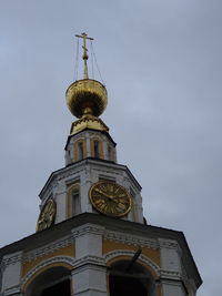 Low angle view of clock tower against sky