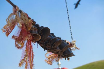 Low angle view of carousel against sky