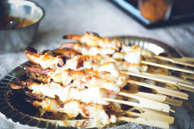 High angle view of meat on barbecue grill