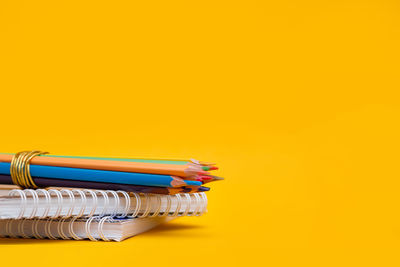 Close-up of equipment on yellow background