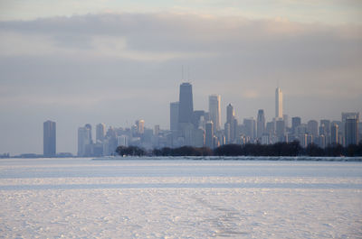 View of cityscape against sky during winter