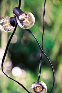 Low angle view of light bulb hanging from ceiling