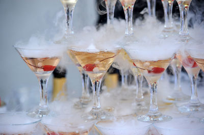 Close-up of wine glasses on table