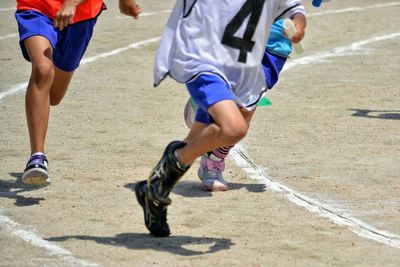 Runners sprinting on track