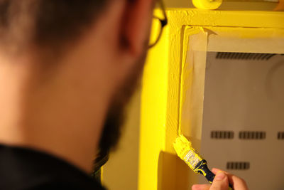 Close-up of woman holding thermometer