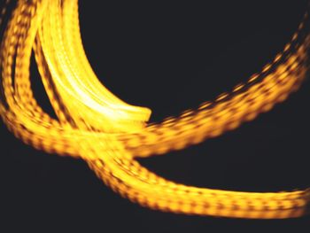 Close-up of light trails against black background