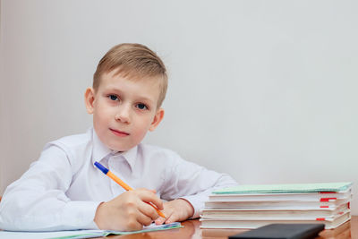 Portrait of boy holding book