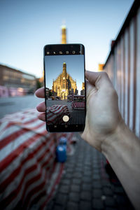 Man using mobile phone in city