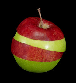 Close-up of apple against black background