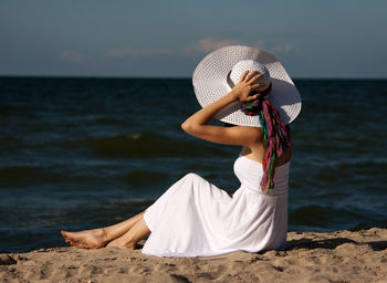 Woman sitting on beach