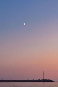 Scenic view of sea against clear sky during sunset