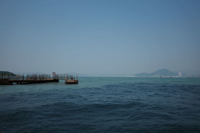 Scenic view of sea against clear blue sky