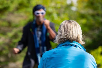 Rear view of couple against blurred background