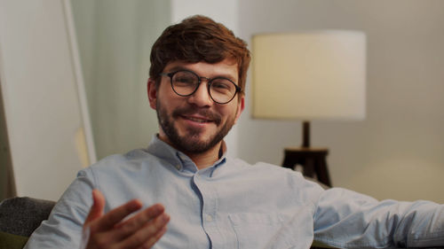 Portrait of man smiling at home