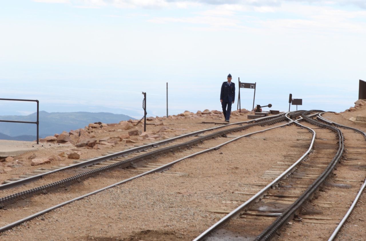 the way forward, sky, transportation, diminishing perspective, railroad track, vanishing point, tranquility, tranquil scene, empty, travel, rail transportation, cloud, nature, outdoors, landscape, day, cloud - sky, road, rear view