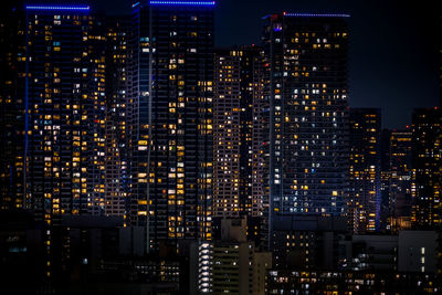 Illuminated buildings in city at night