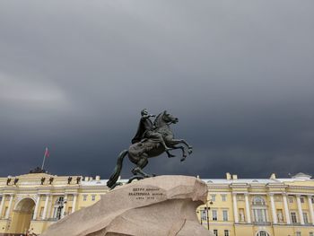 Low angle view of statue against cloudy sky