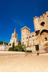 Low angle view of historical building against blue sky