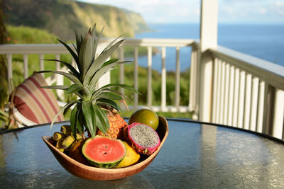 Fruits in container on table in balcony