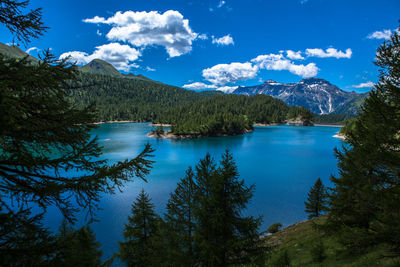 Scenic view of lake and mountains against sky