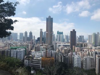 Modern buildings in city against sky
