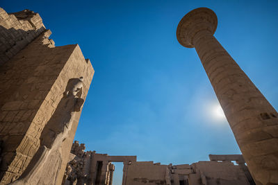 Low angle view of historic building against clear blue sky