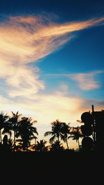 Low angle view of silhouette trees against sky at sunset