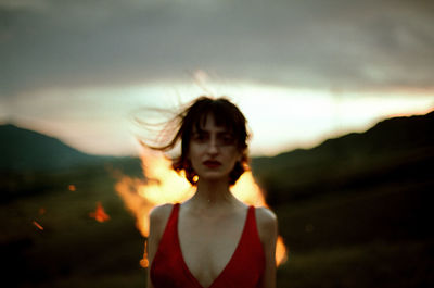 Portrait of girl against sky during sunset