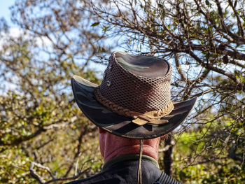 Low angle view of person against trees