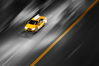 High angle view of yellow car on street