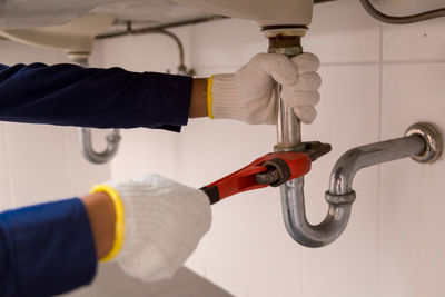 Close-up of man working in kitchen