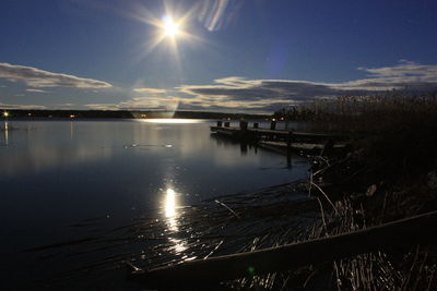 Scenic view of lake at sunset