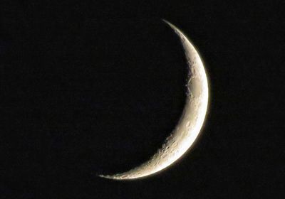 Low angle view of moon against sky at night