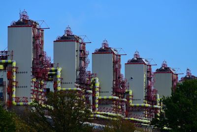 Low angle view of buildings against blue sky