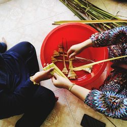 High angle view of people hand on tiled floor